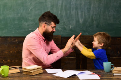 teacher and child playing